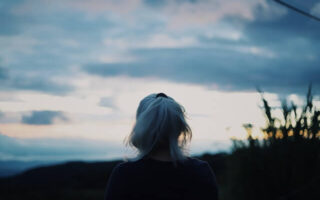 White haired female staring at the horizon