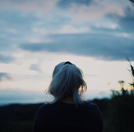 White haired female staring at the horizon